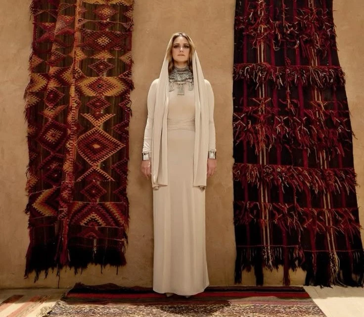 Young Saudi fashion student working in a professional fashion design studio in Riyadh.